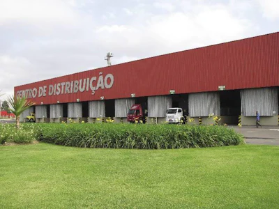 Total's headquarters includes a large distribution center where trucks back into bays lining the back wall of the company warehouse. Once products go to the other side of that wall (to the docks), they are considered the customer's property.